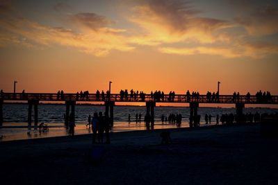 Scenic view of beach against sky during sunset