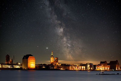 Illuminated buildings in city at night