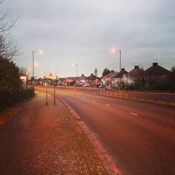 City street against cloudy sky