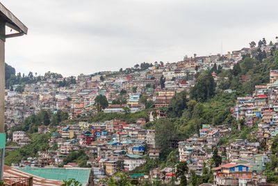 Aerial view of townscape against sky