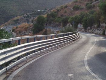 Empty road by mountain