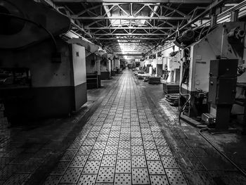 Empty alley amidst buildings in city