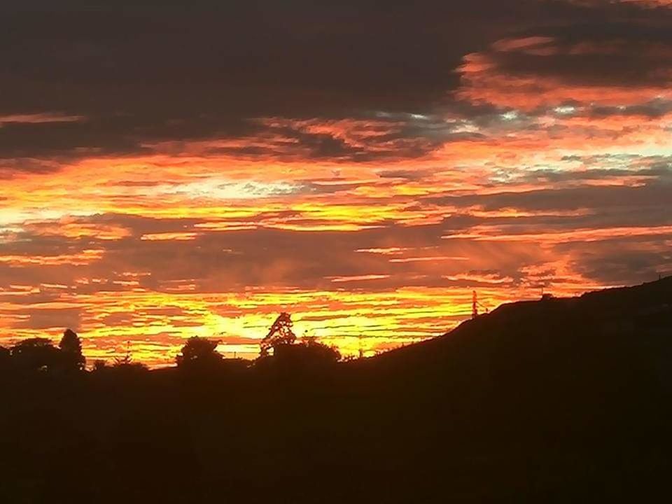 sunset, sky, cloud - sky, orange color, silhouette, scenics - nature, beauty in nature, tranquil scene, tranquility, nature, idyllic, no people, dramatic sky, environment, non-urban scene, landscape, outdoors, tree, land, sunlight