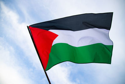 Low angle view of flag against sky