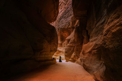 Rear view of people on rock