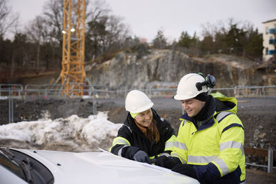 Engineers talking at building site