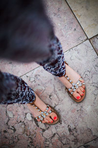 Low section of woman standing on ground