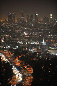 Aerial view of city lit up at night