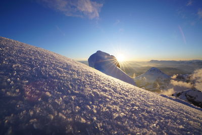 Scenic view of snow covered landscape against sky