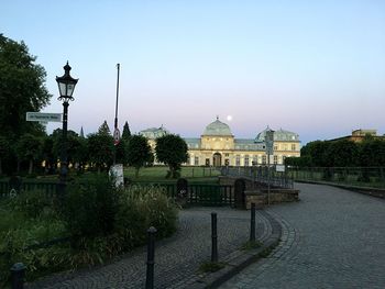 Gazebo in city against clear sky