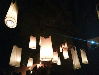 Low angle view of illuminated lanterns hanging on ceiling