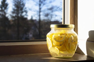 Close-up of glass of jar on table