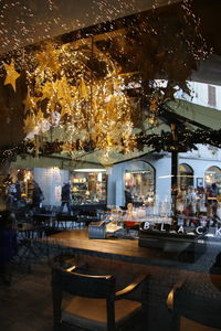 Illuminated restaurant table in city at night