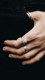 Close-up of hands against black background