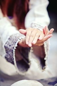 Close-up of hands on table
