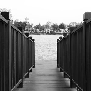 Empty footbridge towards water