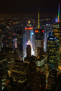 High angle view of illuminated buildings in city at night