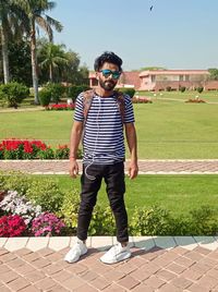 Rear view of man standing on field