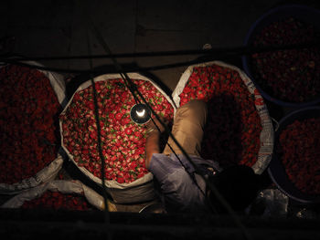 Overhead view of man selling rose at market