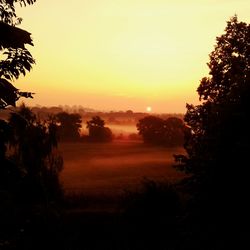 Scenic view of landscape at sunset