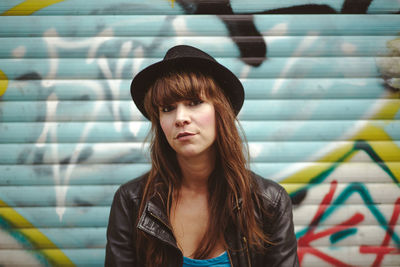 Portrait of young woman standing outdoors