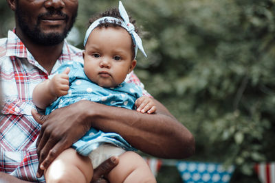 Portrait of father with baby