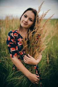 Young woman standing on field