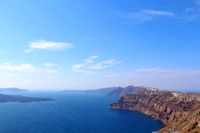 Scenic view of sea against blue sky