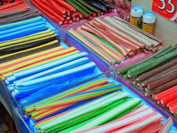 Close-up of colorful candies in container for sale