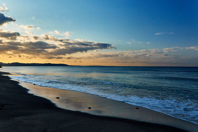 Scenic view of sea against sky during sunrise