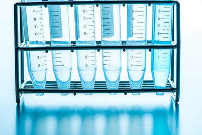 Close-up of test tubes against white background