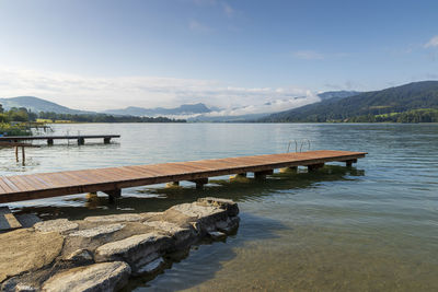 Pier over lake against sky