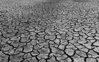 Mudflat cracked desert for natural background layer wallpaper of drought effects of global warming