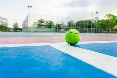 Close-up of tennis ball on court