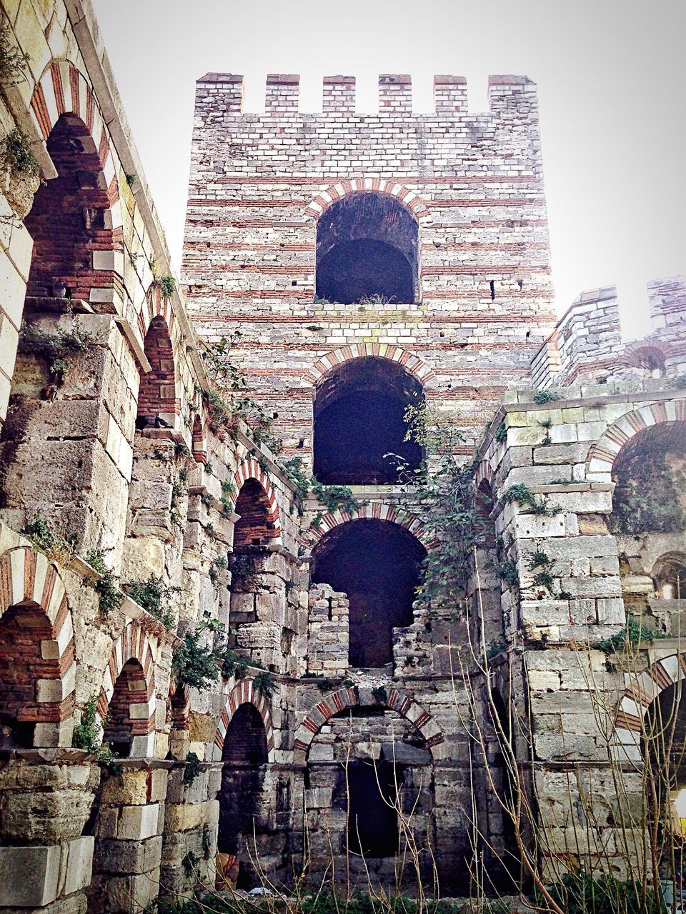 architecture, built structure, building exterior, history, old, old ruin, abandoned, the past, damaged, stone wall, ancient, brick wall, obsolete, ruined, low angle view, weathered, wall - building feature, run-down, deterioration, arch