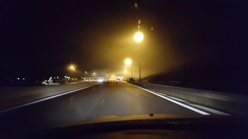 Illuminated road at night