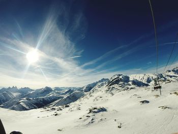 Scenic view of mountains against sky during winter