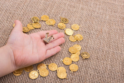 Close-up of hand with jewelry at table