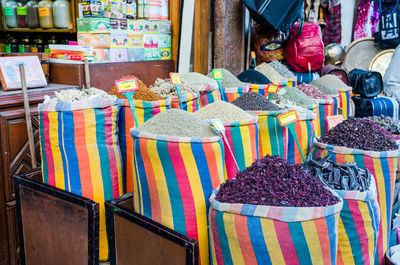 Multi colored umbrellas for sale at market stall