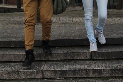 Low section of men standing on steps