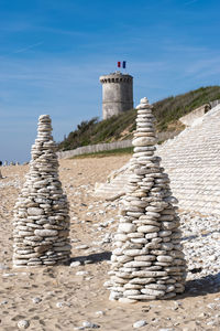 Stone steps on lighthouse against sky