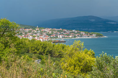 Remains of shipwreck washed ashore spoiling adriatic sea coastline.