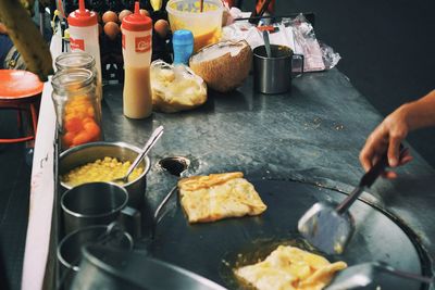 High angle view of man preparing food in kitchen