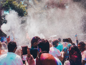 People enjoying holi on street