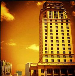 Low angle view of building against sky at sunset