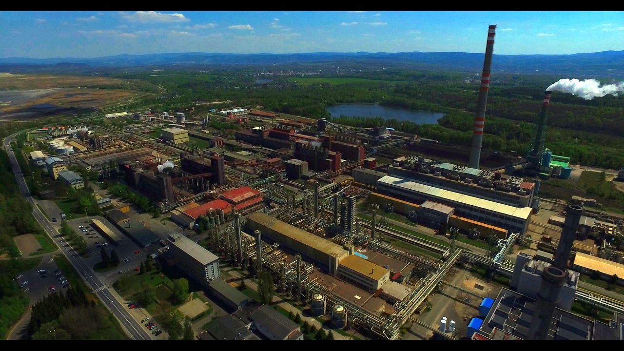 HIGH ANGLE VIEW OF FACTORY IN LANDSCAPE