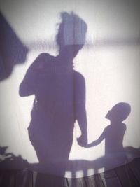 Shadow of woman on wall