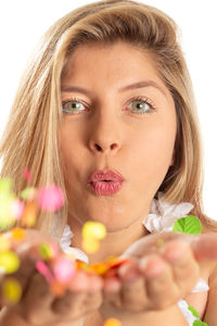 Close-up portrait of a beautiful young woman over white background