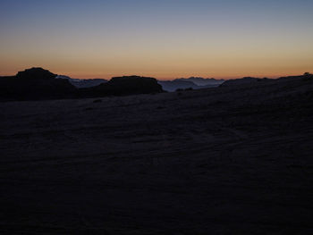 Scenic view of silhouette landscape against sky during sunset