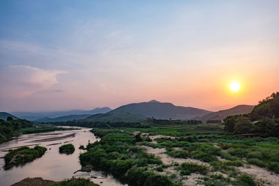 Scenic view of mountains against sky during sunset